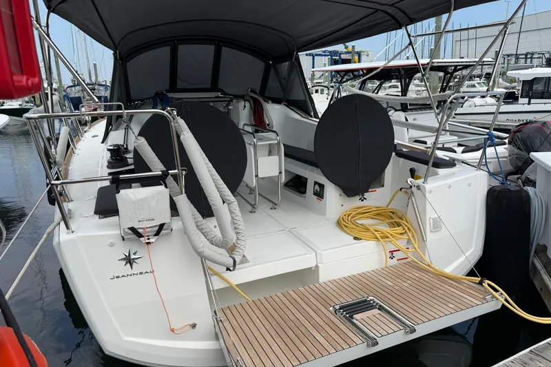 Slide: The Image of 2022 Jeanneau Sun Odyssey 349 Performance yacht docked at marina, rear view. - 24