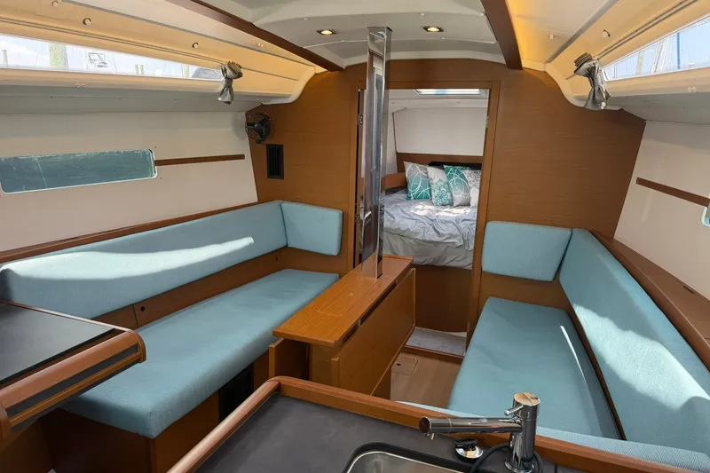 Slide: The Image of Interior of 2022 Jeanneau Sun Odyssey 349 Performance yacht with cozy seating and cabin. - 23