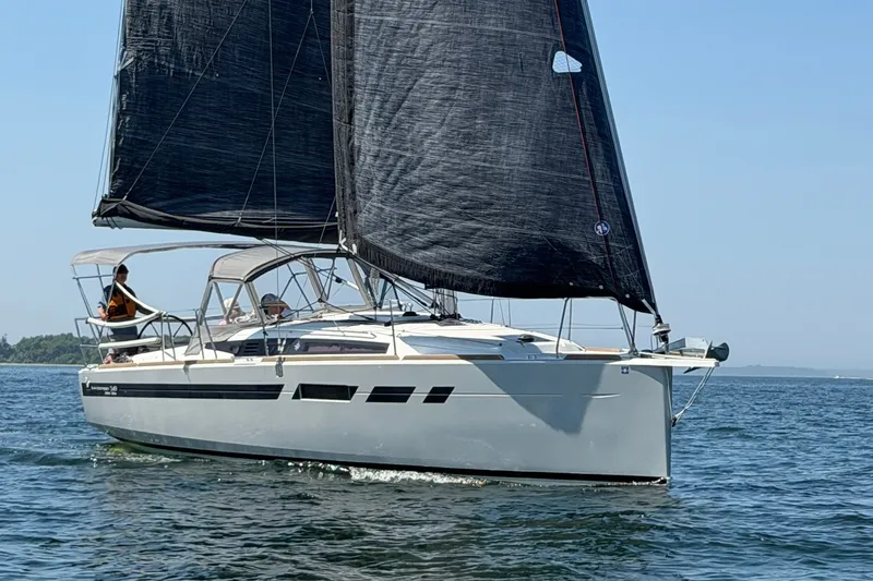 Slide: The Image of 2022 Jeanneau Sun Odyssey 349 Performance sailboat cruising on open water. - 20