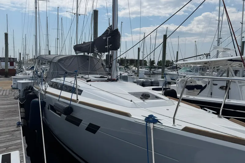 Slide: The Image of 2022 Jeanneau Sun Odyssey 349 Performance sailboat docked at marina. - 15