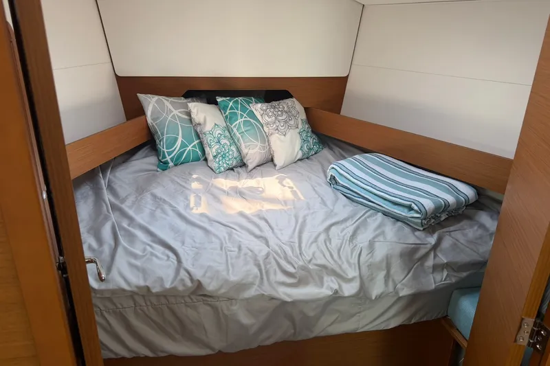 Slide: The Image of Cozy cabin interior of 2022 Jeanneau Sun Odyssey 349 Performance yacht with stylish bedding. - 44
