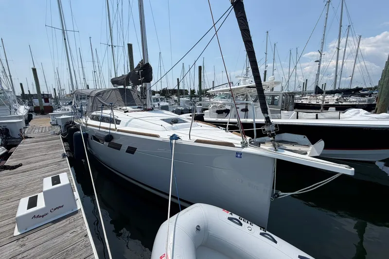 Slide: The Image of 2022 Jeanneau Sun Odyssey 349 Performance sailboat docked at marina. - 1