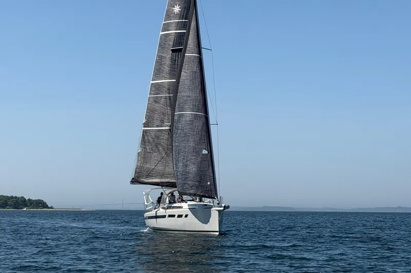Slide: The Image of 2022 Jeanneau Sun Odyssey 349 Performance sailing on open water under clear skies. - 49