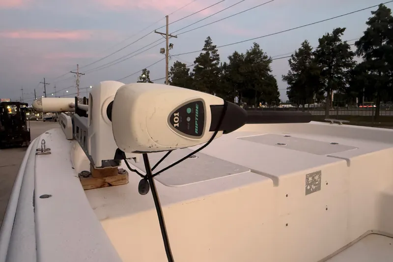 Slide: The Image of 2011 Carolina Skiff 218 DLV boat with trolling motor at sunset. - 9