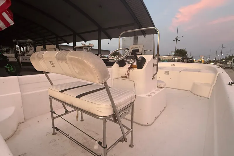 Slide: The Image of 2011 Carolina Skiff 218 DLV boat interior with steering console and seating. - 12
