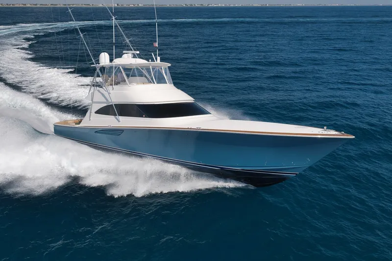Slide: The Image of A 2017 Viking 62 Convertible speeds across the blue sea, with a clear, sunny view. - 13