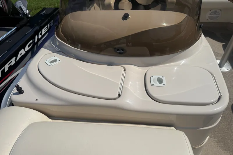 Slide: The Image of 2006 Triton Summit Pontoon 220 T Platinum dashboard with beige console and windshield. - 26