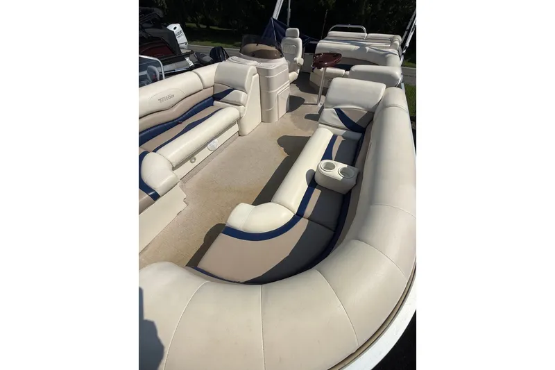 Slide: The Image of 2006 Triton Summit Pontoon 220 T Platinum interior with beige seating and cup holders. - 5