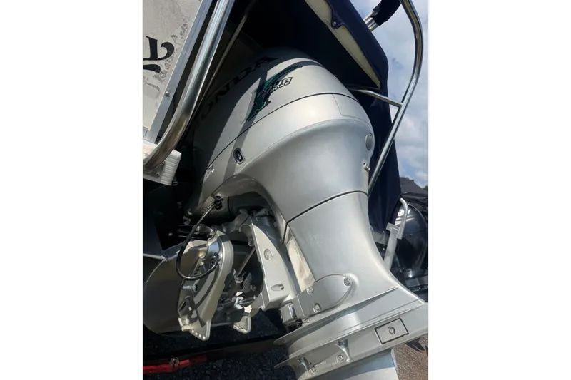Slide: The Image of Close-up of a Honda outboard motor on a 2006 Triton Summit Pontoon 220 T Platinum. - 28
