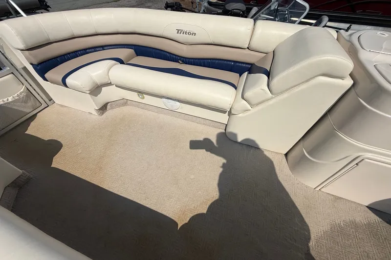 Slide: The Image of 2006 Triton Summit Pontoon 220 T Platinum interior with beige and blue seating. - 8