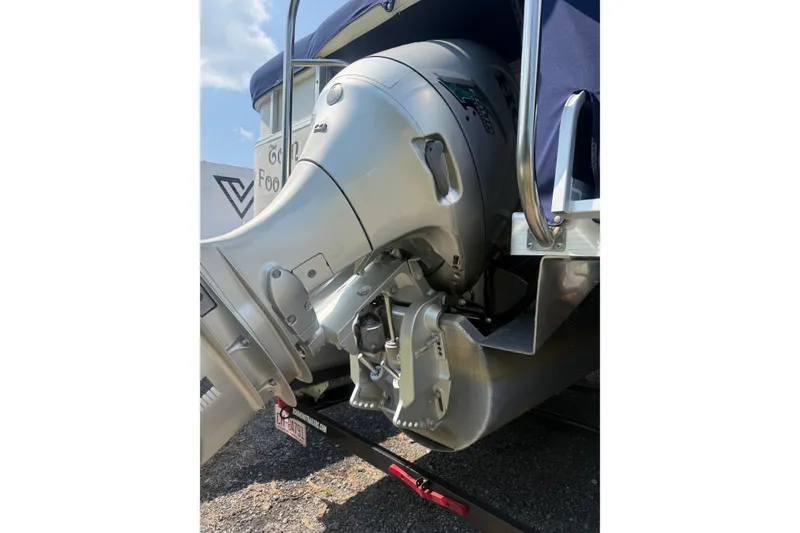 Slide: The Image of 2006 Triton Summit Pontoon 220 T Platinum outboard motor close-up, showcasing engine details. - 30