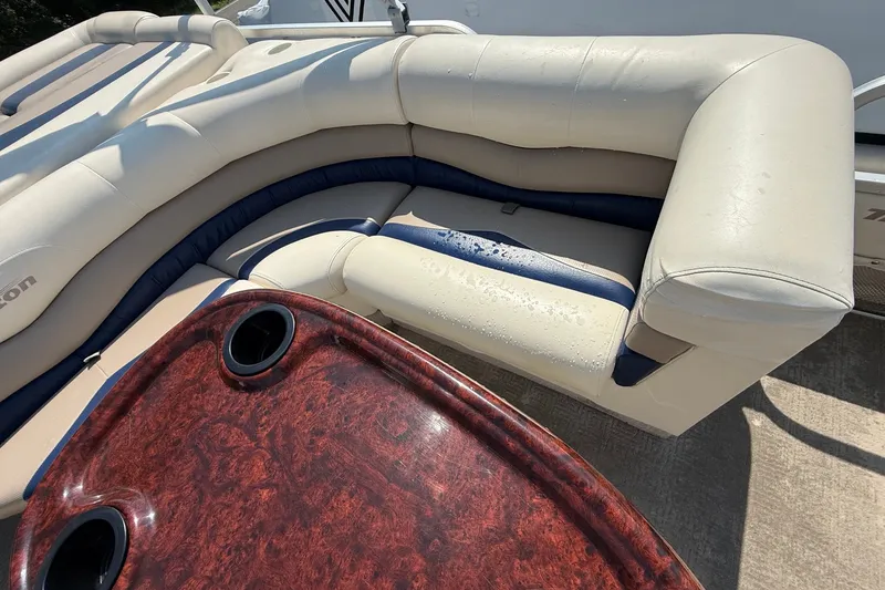 Slide: The Image of 2006 Triton Summit Pontoon 220 T Platinum with beige seating and wooden table. - 11
