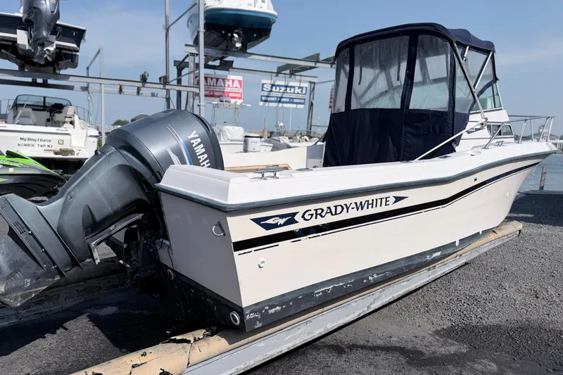 Slide: The Image of 1993 Grady-White Seafarer 22 boat with Yamaha outboard motor on display at marina. - 4