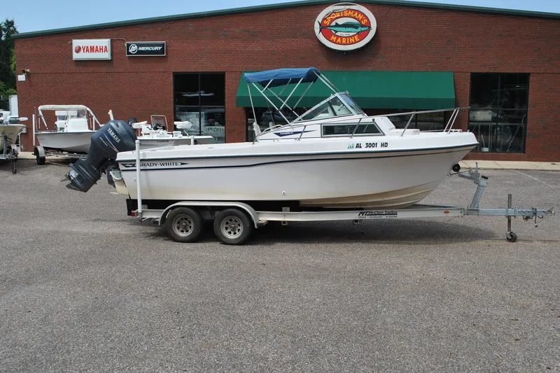 Slide: The Image of 1988 Grady-White Overnighter 20 boat on trailer outside marine dealership. - 4