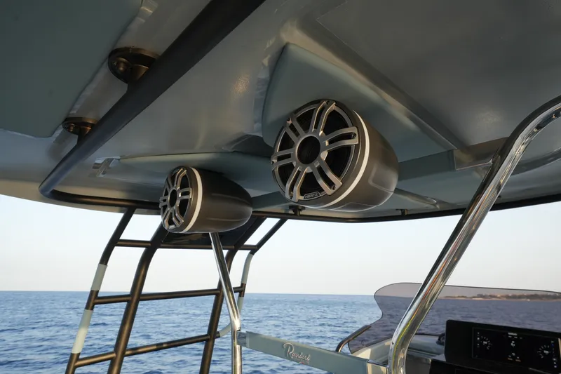 Slide: The Image of 2025 Ranieri Cayman 33 Executive boat speakers and ladder with ocean view. - 20