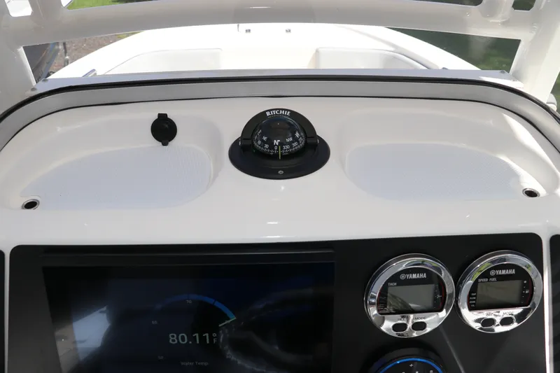 Slide: The Image of Dashboard of 2027 Robalo 226 Cayman boat with compass and Yamaha gauges. - 18