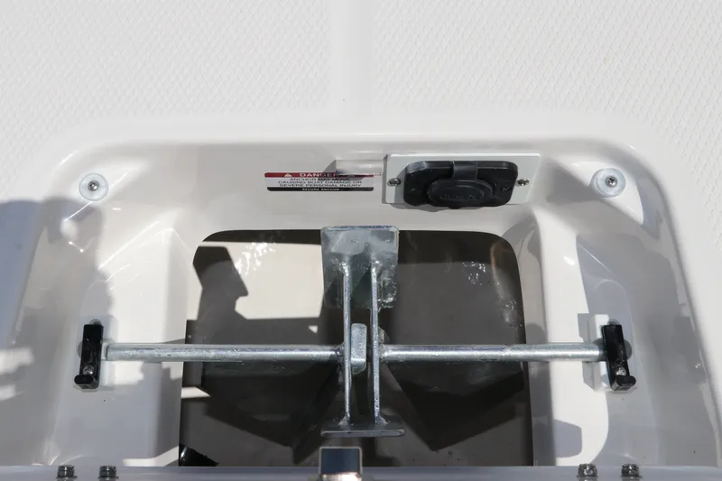 Slide: The Image of 2027 Robalo 226 Cayman boat anchor compartment with secure fittings and drainage system. - 29