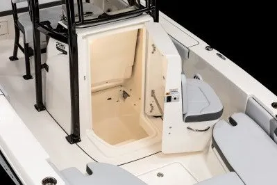 Slide: The Image of 2027 Robalo 226 Cayman boat interior with open storage compartment and seating. - 6