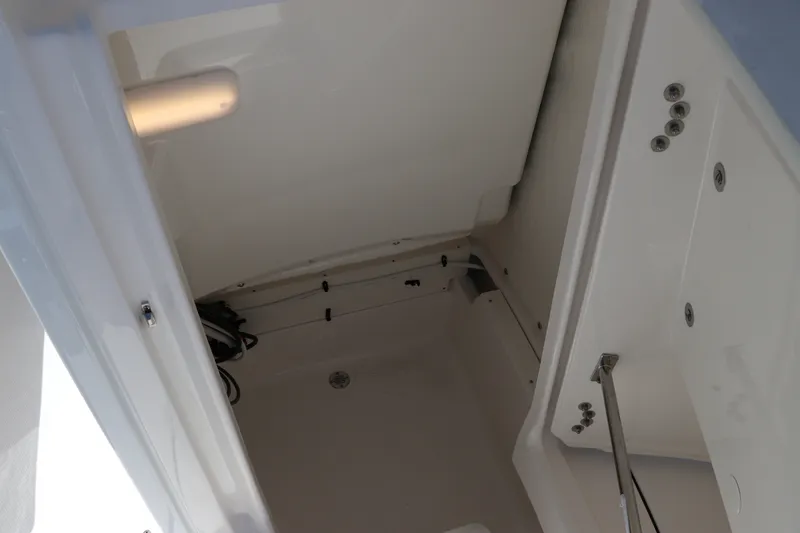 Slide: The Image of Interior view of 2027 Robalo 226 Cayman boat compartment. - 22