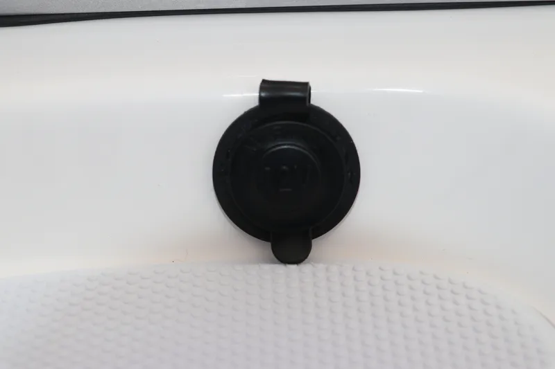 Slide: The Image of 12V power outlet on 2027 Robalo 226 Cayman boat. - 19