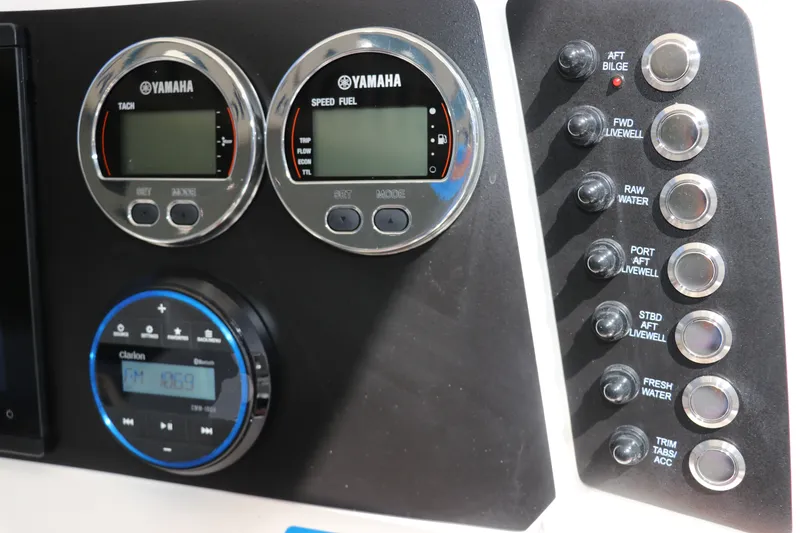 Slide: The Image of Control panel of 2027 Robalo 226 Cayman boat with Yamaha gauges and switches. - 14