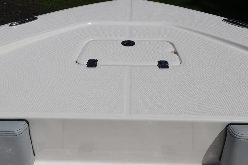 Slide: The Image of Bow deck of 2027 Robalo 226 Cayman boat with storage hatch. - 28