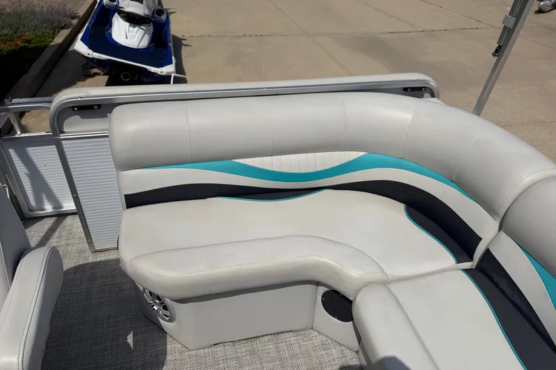 Slide: The Image of Pontoon boat seating with teal and black accents, Quest Edge 820, 2020 model. - 11