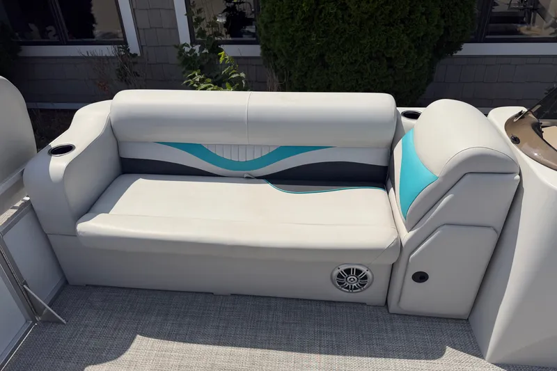 Slide: The Image of Modern boat seating with teal accents on a Quest Edge 820, 2020 model. - 7