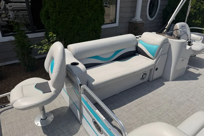 Slide: The Image of Pontoon boat interior with cushioned seating, featuring teal accents, Quest Edge 820, 2020 model. - 5