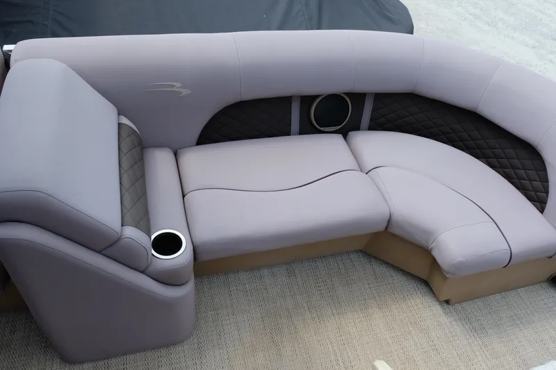 Slide: The Image of 2018 Bennington 21 SLXP boat seating with quilted upholstery and cup holder. - 5