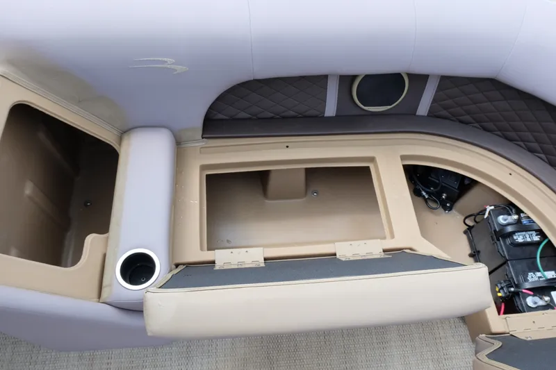 Slide: The Image of Interior view of a 2018 Bennington 21 SLXP boat showing storage compartments and seating. - 6