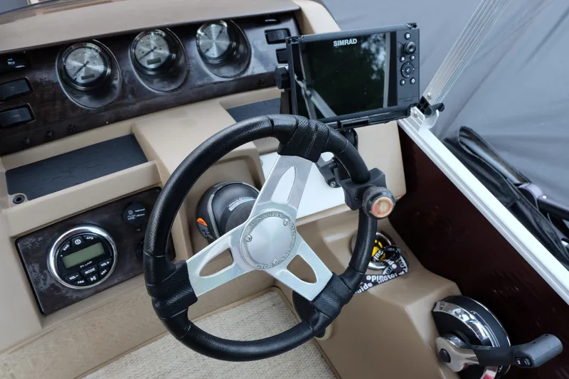 Slide: The Image of Steering console of a 2018 Bennington 21 SLXP boat with gauges and navigation system. - 11