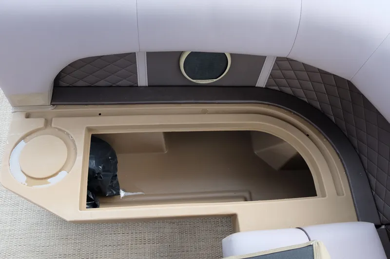 Slide: The Image of Interior storage compartment of a 2018 Bennington 21 SLXP boat with quilted upholstery. - 17