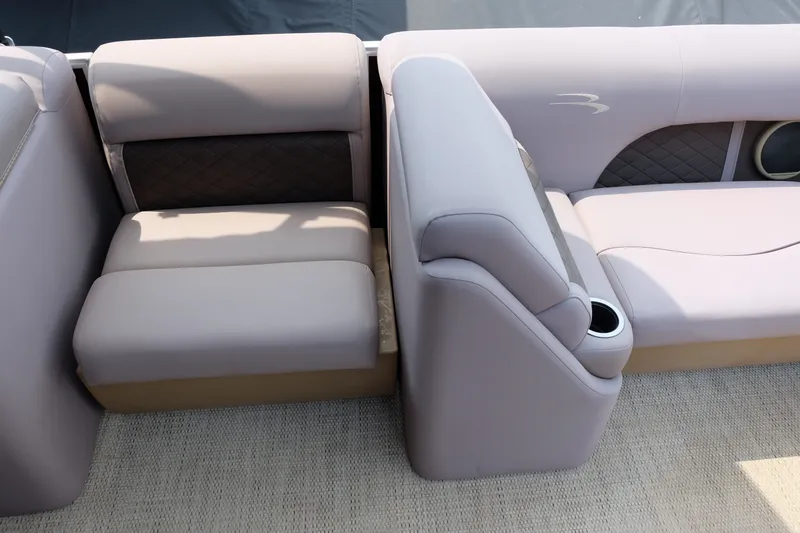 Slide: The Image of 2018 Bennington 21 SLXP boat interior with plush seating and cup holder. - 8