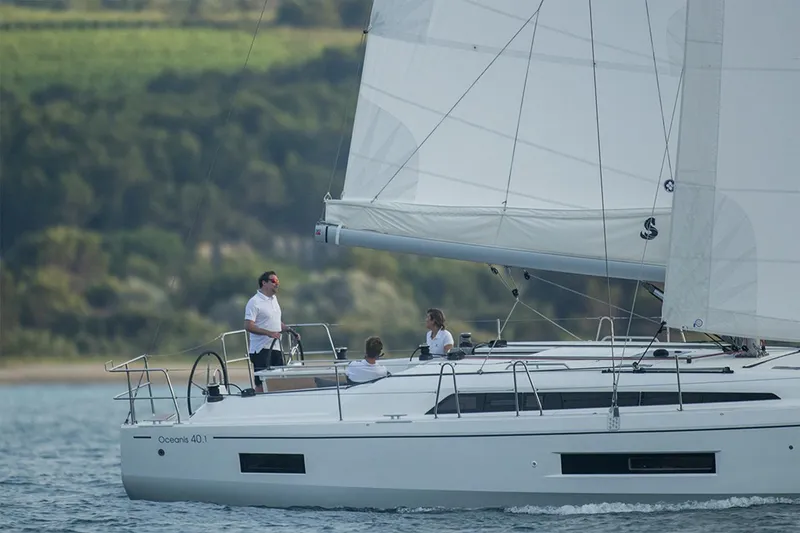 Slide: The Image of Manufacturer Provided Image: 2026 Beneteau Oceanis 40.1 sailing with three people on board. - 1