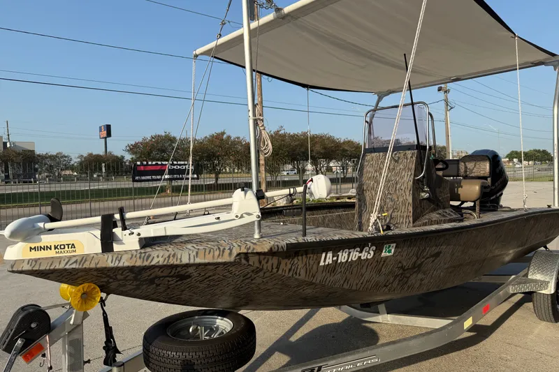 Slide: The Image of 2024 Xpress H190B Bay boat with Minn Kota Maxxum trolling motor on trailer. - 6