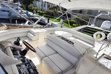 Slide: The Image of 1998 Viking Princess 56 Sport Cruiser with spacious deck and luxurious seating. - 15