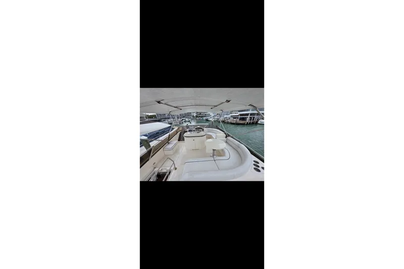 Slide: The Image of 1998 Viking Princess 56 Sport Cruiser yacht interior with marina view. - 38