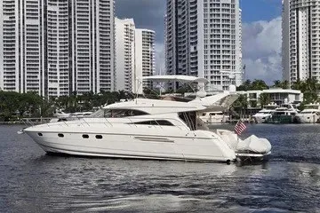 Slide: The Image of 1998 Viking Princess 56 Sport Cruiser yacht on water, city skyline background. - 3
