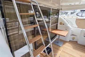 Slide: The Image of 1998 Viking Princess 56 Sport Cruiser with teak deck and stainless steel ladder. - 19