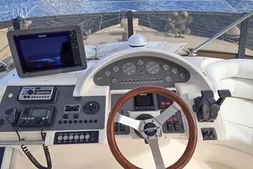 Slide: The Image of Cockpit of 1998 Viking Princess 56 Sport Cruiser with navigation instruments and steering wheel. - 12