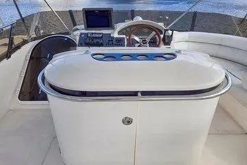 Slide: The Image of 1998 Viking Princess 56 Sport Cruiser helm with modern navigation equipment and sleek design. - 13
