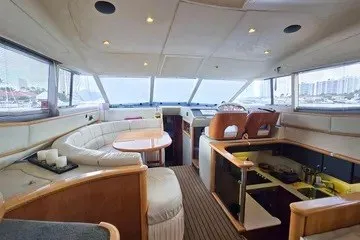 Slide: The Image of Interior of 1998 Viking Princess 56 Sport Cruiser with elegant seating and helm. - 28