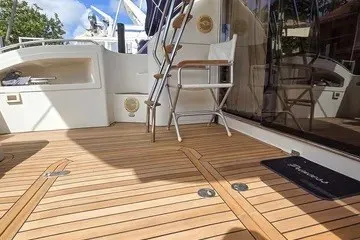 Slide: The Image of 1998 Viking Princess 56 Sport Cruiser with teak deck and outdoor seating. - 20