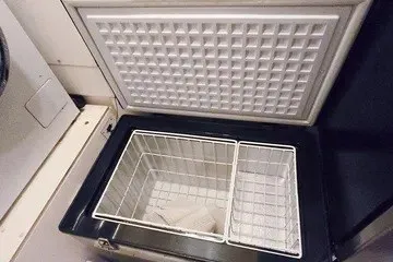 Slide: The Image of Open freezer compartment on 1998 Viking Princess 56 Sport Cruiser yacht. - 27
