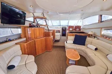 Slide: The Image of Luxurious interior of a 1998 Viking Princess 56 Sport Cruiser yacht with elegant seating. - 22