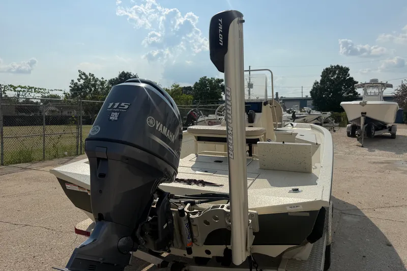 Slide: The Image of 2013 Xpress H20B Bay boat with Yamaha 115 engine, parked outdoors. - 9