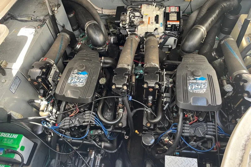Slide: The Image of Engine compartment of a 2003 Sea Ray Sundancer 320 with twin MerCruiser 350 engines. - 12