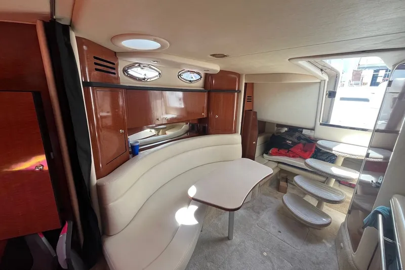 Slide: The Image of Interior of 2003 Sea Ray Sundancer 320 yacht with seating and wooden cabinetry. - 7