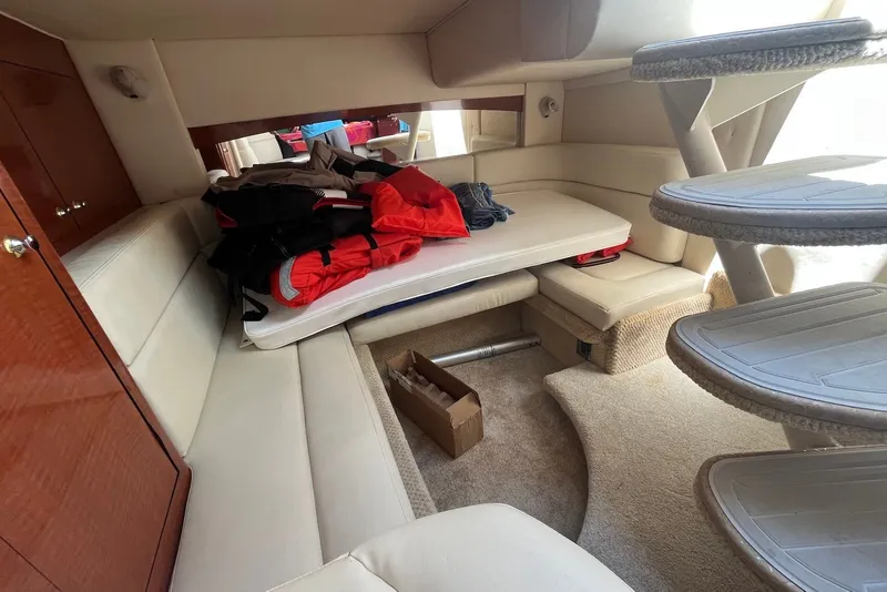 Slide: The Image of Interior of 2003 Sea Ray Sundancer 320 with seating, stairs, and storage. - 9